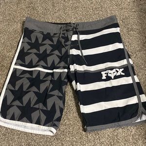 Navy and grey stars and strips fox swimsuit. New without tags- never worn